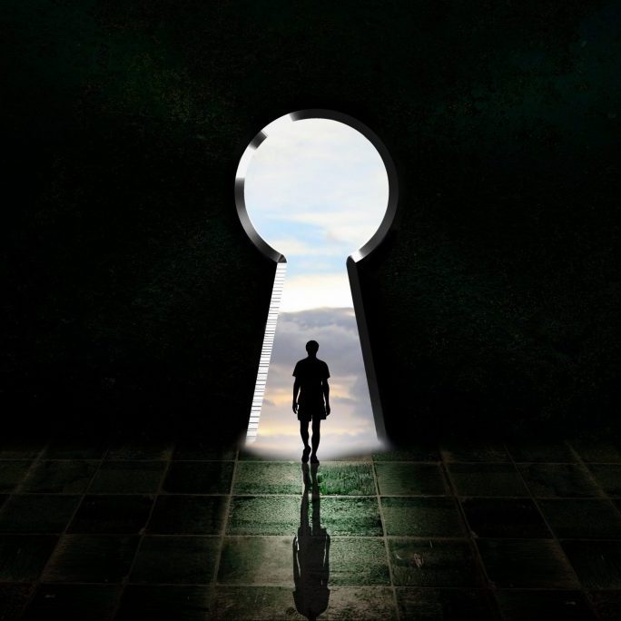 young man in keyhole light, schematic dark room with a big key d young man in keyhole light, schematic dark room with a big key d